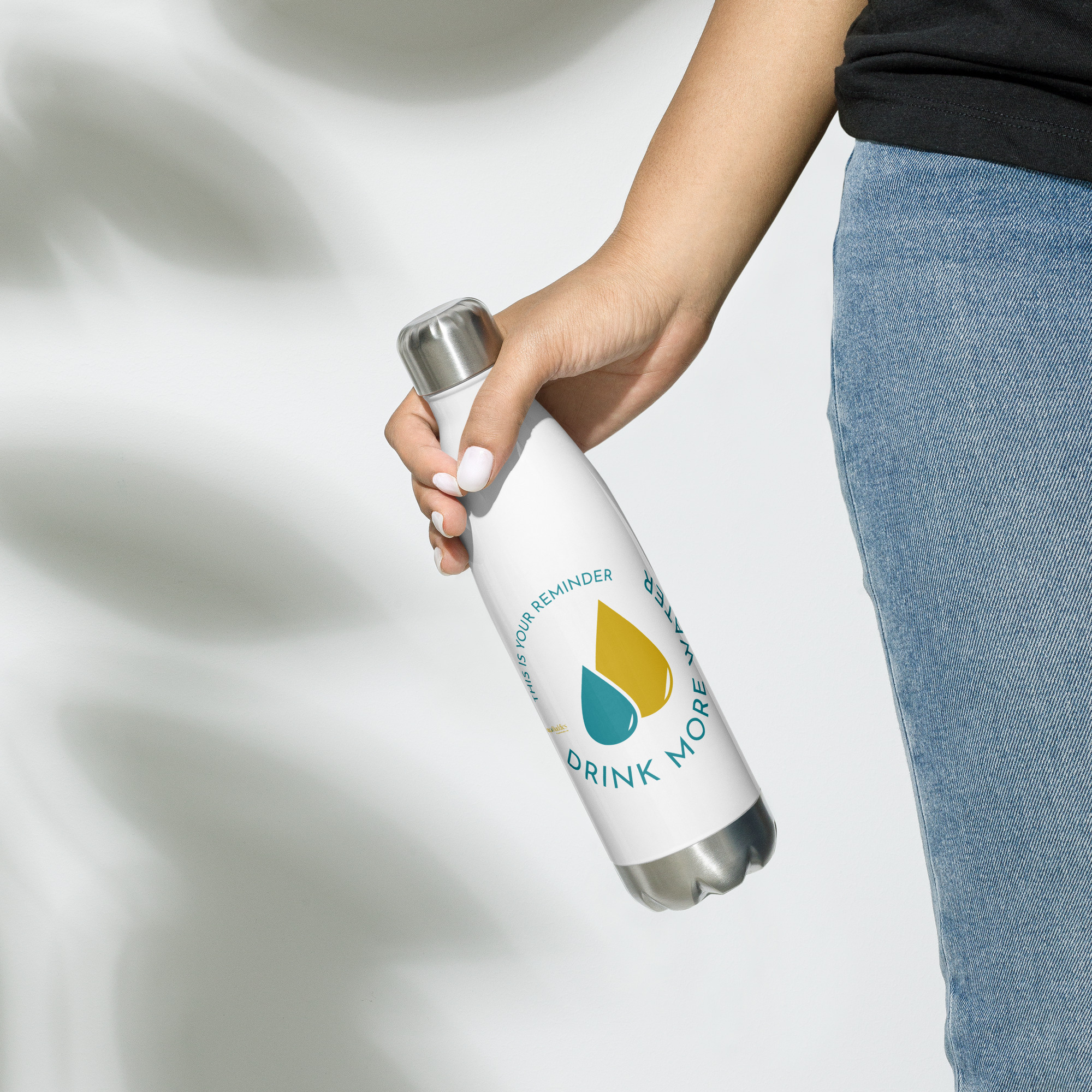 white stainless steel water bottle with circular logo reading "This is your reminder. Drink more water"